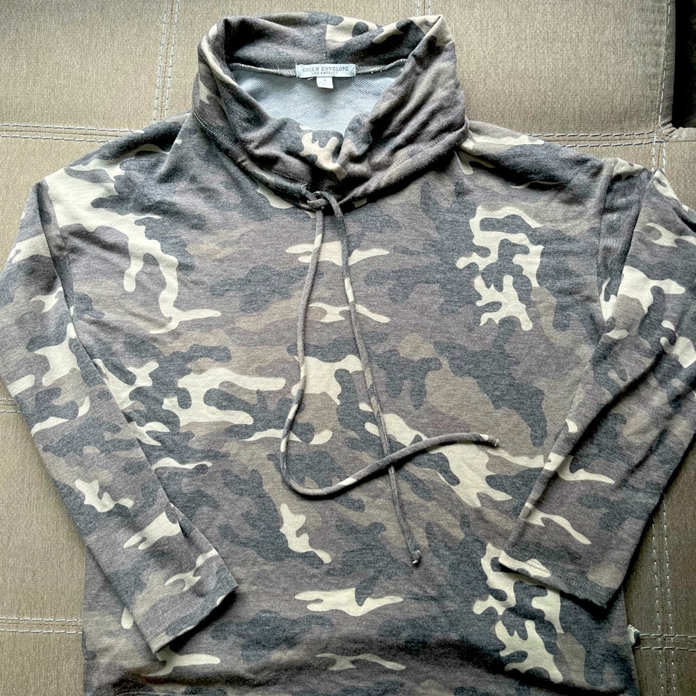 Woman’s medium camouflage long sleeve shirt.